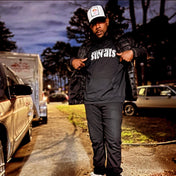 model has on our iconic black sweats original hoodie with white logo