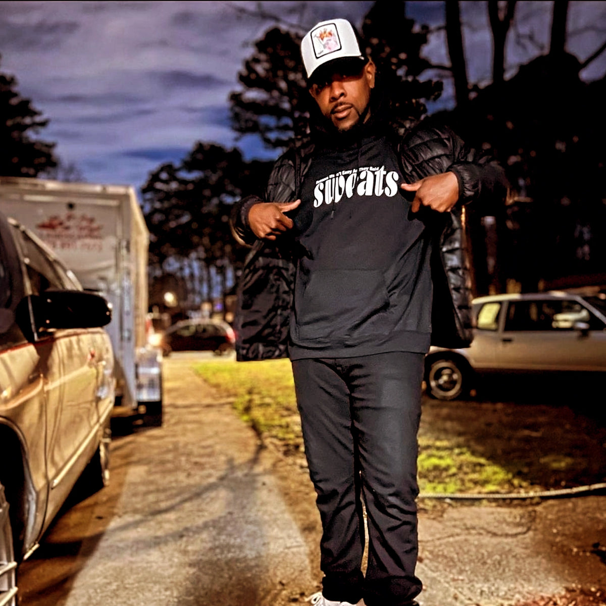model has on our iconic black sweats original hoodie with white logo