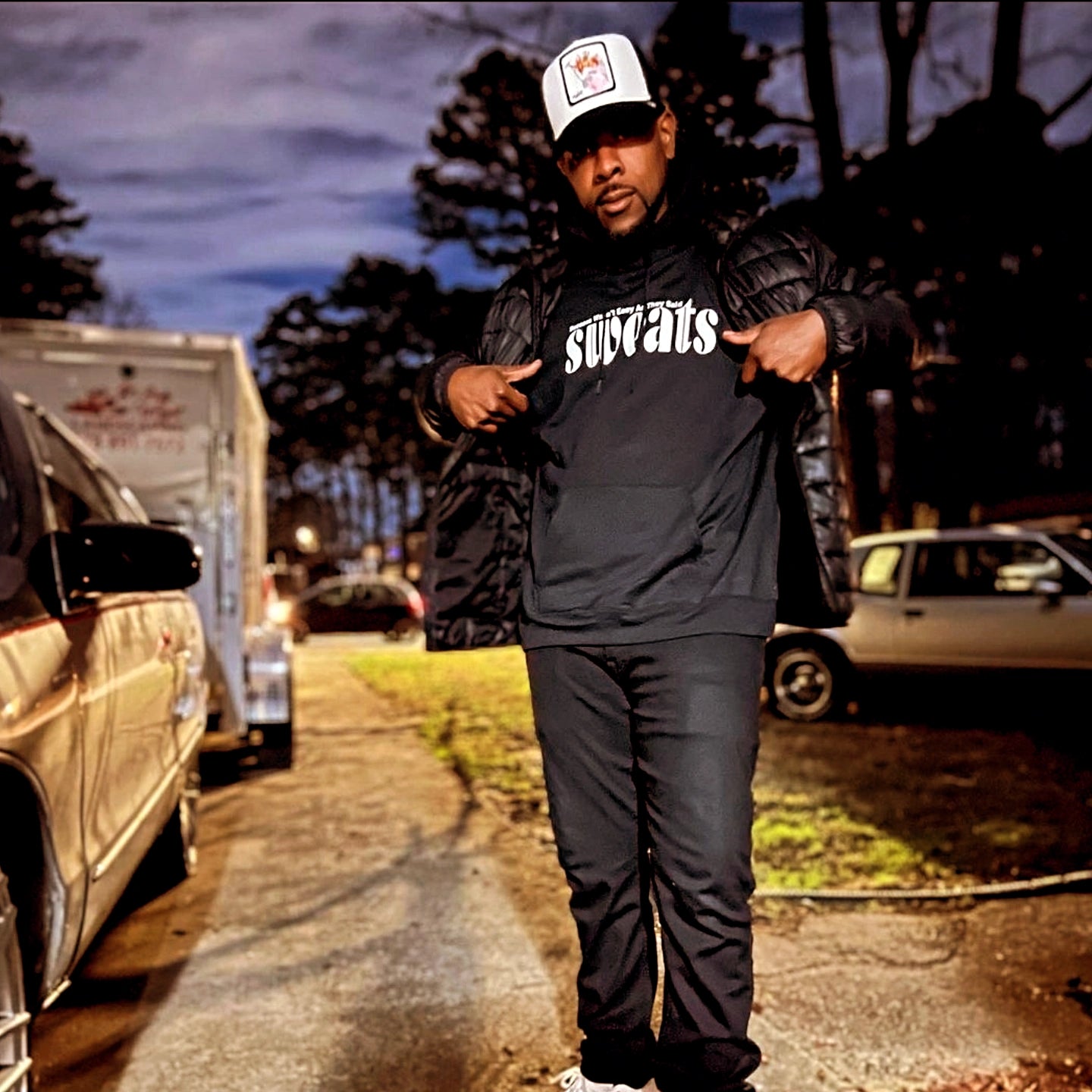 model has on our iconic black sweats original hoodie with white logo
